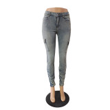 Fashionable and personalized low rise high elastic jeans with pleated side pockets
