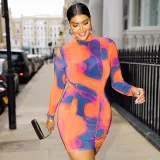 Fashionable round neck long sleeve irregular printed buttocks dress