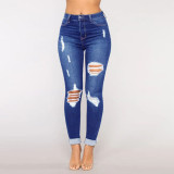 Women's jeans with holes and small feet