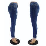 Nine point slim hip hole low rise fringed women's jeans