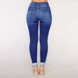 Women's jeans with holes and small feet