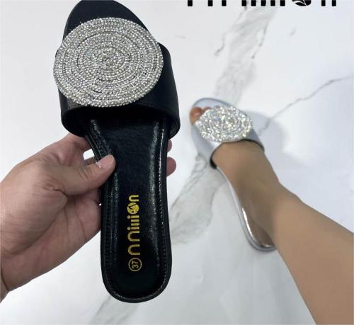 Flat sandals with rhinestone slippers on the outside