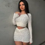 Solid color slanted shoulder long sleeved top slim fitting split short skirt set