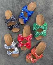 Oversized bow sandals and slippers