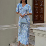 Short sleeved satin drape creates a slimming, backless style printed long dress