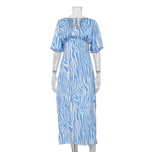 Short sleeved satin drape creates a slimming, backless style printed long dress