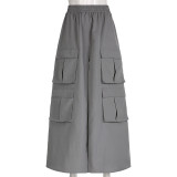 Solid woven high waisted elastic stitching with multiple pockets, loose fit, oversized work style A-line half length skirt
