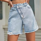 High waisted loose fitting and slimming denim shorts with raw edges