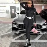 Tight solid color long sleeved hooded jumpsuit