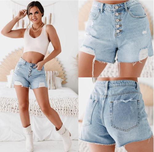 Washed denim shorts with holes and rough edges