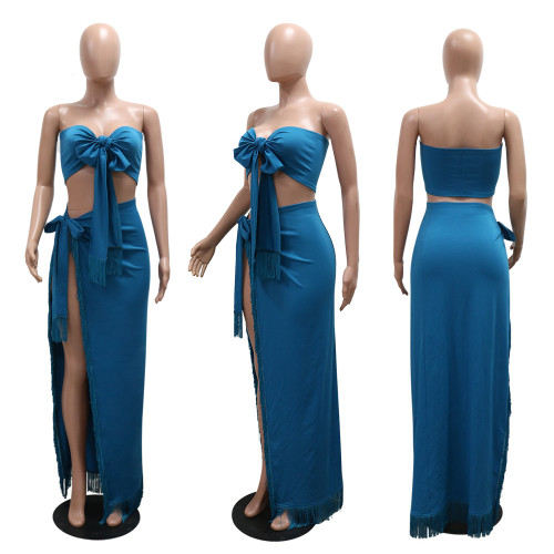 High slit tassel long skirt paired with strapless top and tie up two-piece set