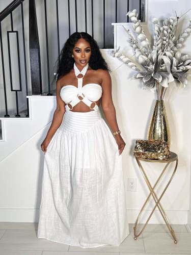Two piece set of padded strapless top with suspender and neck hanging long skirt