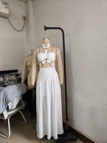 Two piece set of padded strapless top with suspender and neck hanging long skirt