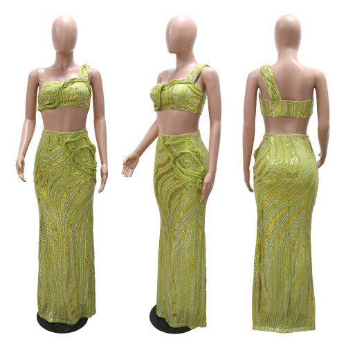 Sleeveless single shoulder short top paired with hip hugging skirt