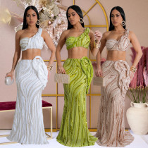 Sleeveless single shoulder short top paired with hip hugging skirt