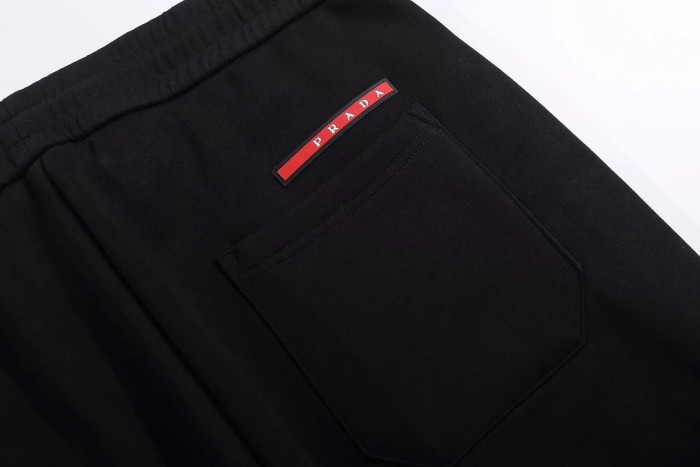 追跡付 プラダ n級品 前刺繍ロゴ後袋三角標赤色飾条加絨毯長ズボン