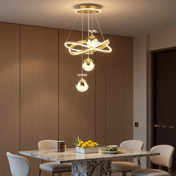 An LED pendant light with 3 spherical lamp heads and a surrounding light ring, featuring adjustable three color temperatures, adjustable height, and illuminated base; suitable for living room, dining room, bedroom, etc