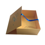Matt yellow gold ribbon design box with sinly glitter blue logo on paper suitcase bridal gift packaging box