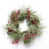 classic green leaves with snow and red berries Christmas wreath for Christmas and home decoration