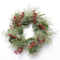 classic green leaves with snow and red berries Christmas wreath for Christmas and home decoration