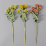 Artificial succulent potted vase with floral arrangement decorated with nice thistle flowers