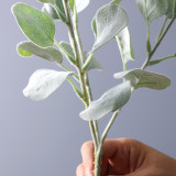 Florist arranges flowers with grass plants wedding hotel decoration simulation planting hair money leaves