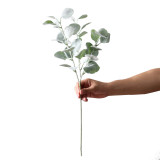 Florist arranges flowers with grass plants wedding hotel decoration simulation planting hair money leaves