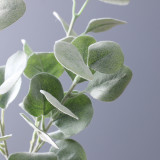 Florist arranges flowers with grass plants wedding hotel decoration simulation planting hair money leaves