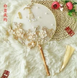 Chinese bride holding flowers round fan of classical Xiu clothing handmade diy