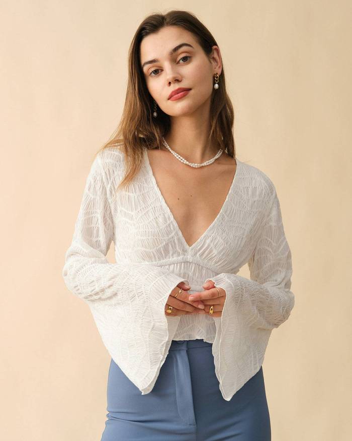 The Solid V Neck Textured Blouse