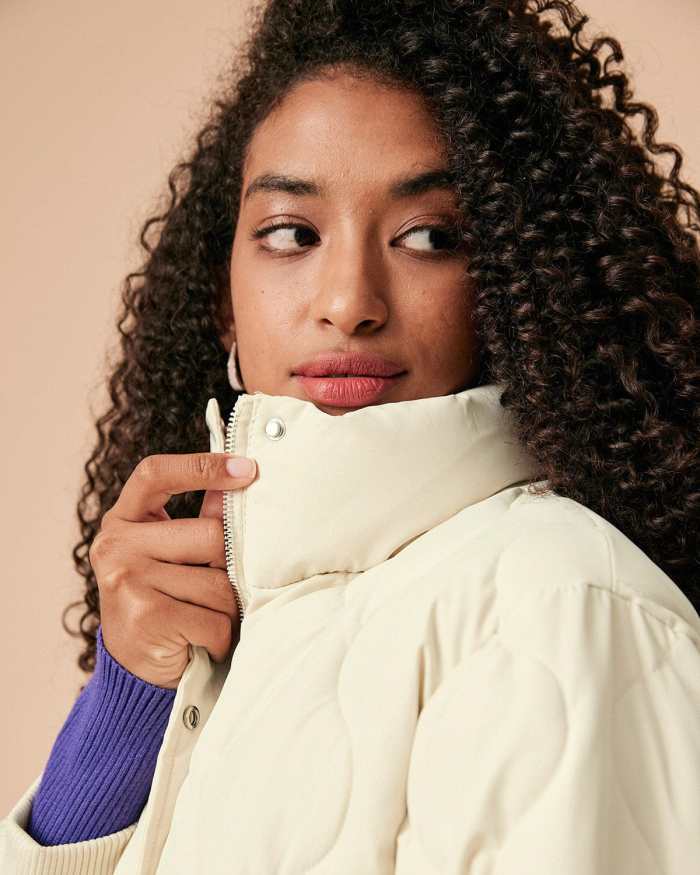 The Beige Mock Neck Belted Quilted Puffer Jacket