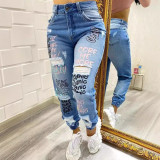 Ihoov Letter-Cut Distressed Skinny Jeans