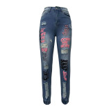 Ihoov Letter-Cut Distressed Skinny Jeans