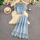 Model wearing the complete Elegance Duo set from ihoov, showcasing the lace embroidered blouse and high-waisted midi skirt