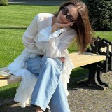 White V-Neck Bell Sleeve Blouse with Ruffle Hem