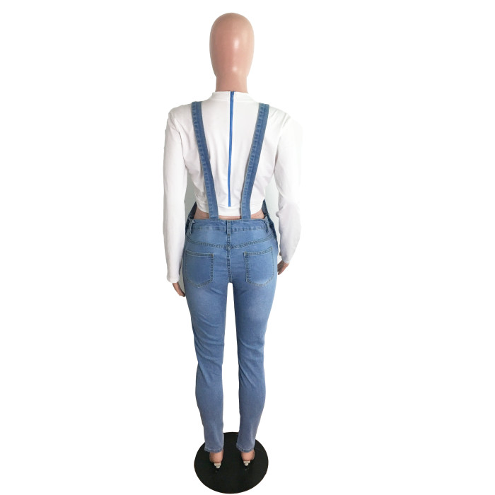 Holed jeans and suspenders