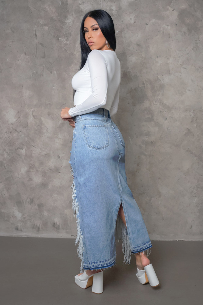Fashionable frayed fringed denim skirt