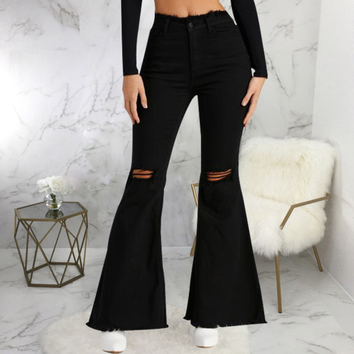 Jeans flared trousers with broken knees