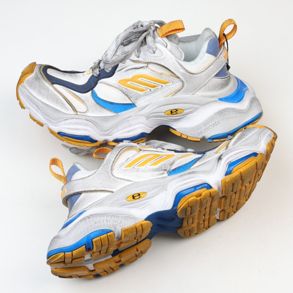 Balenciaga Cargo sneakers in a worn-out white, grey, orange, and blue