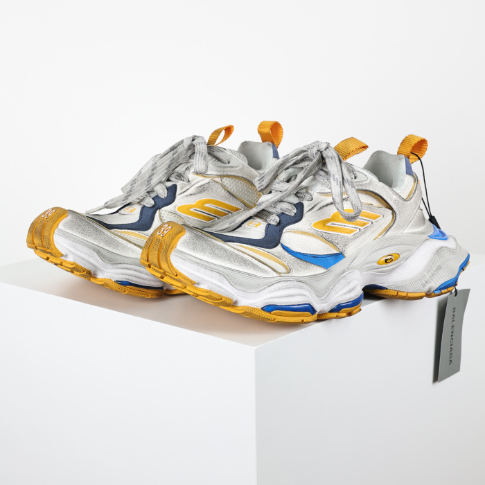 Balenciaga Cargo sneakers in a worn-out white, grey, orange, and blue