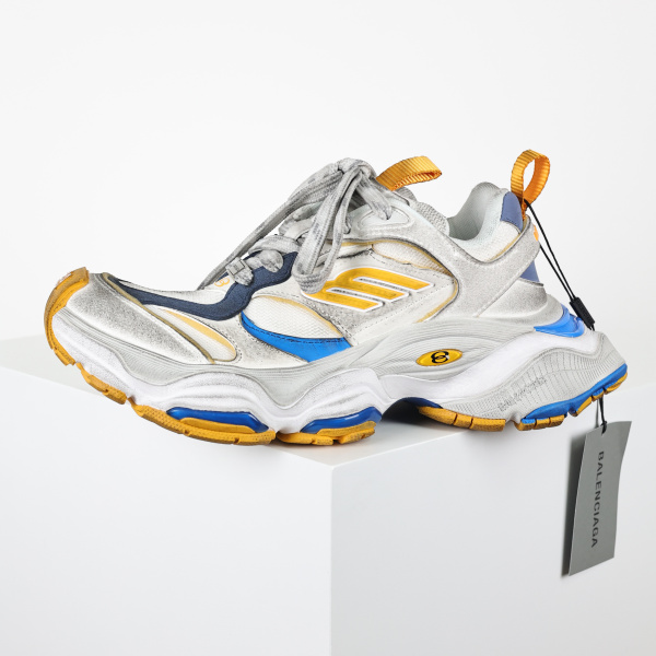 Balenciaga Cargo sneakers in a worn-out white, grey, orange, and blue