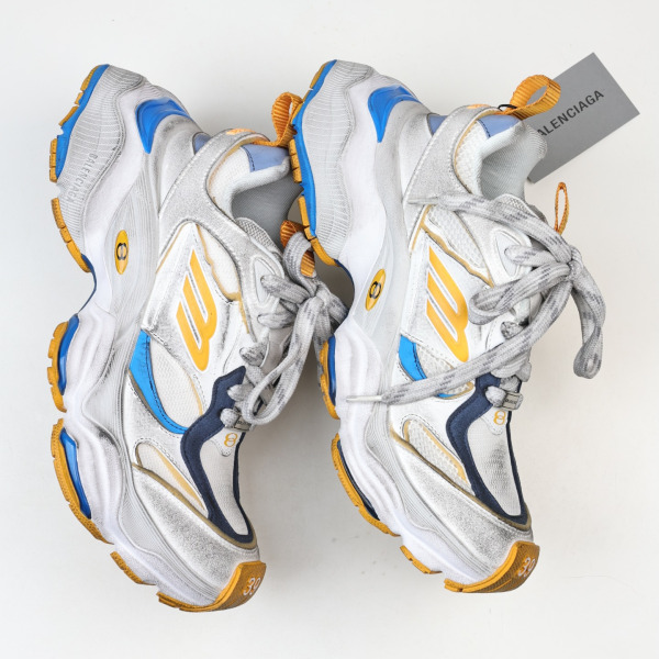 Balenciaga Cargo sneakers in a worn-out white, grey, orange, and blue