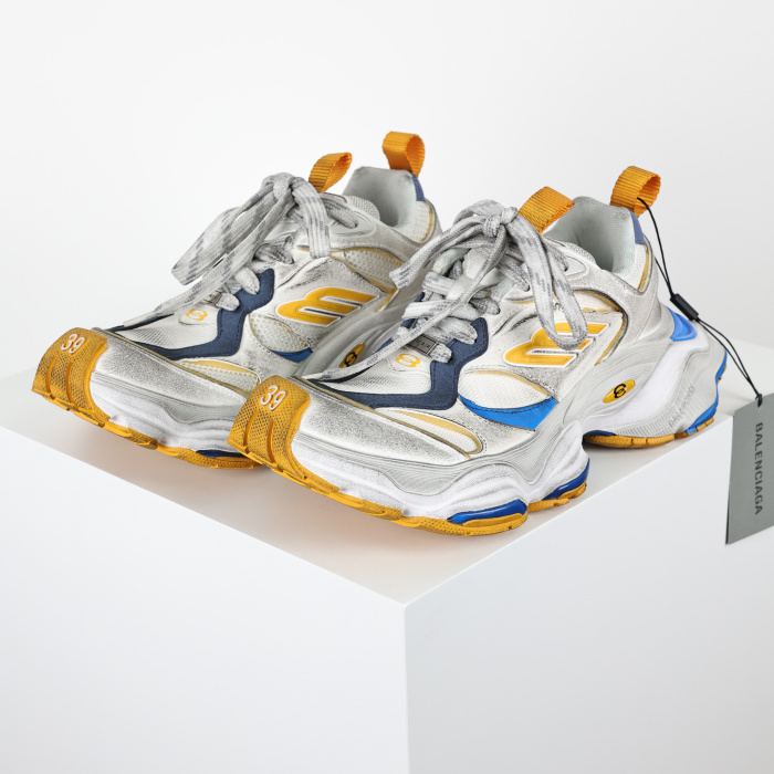 Balenciaga Cargo sneakers in a worn-out white, grey, orange, and blue