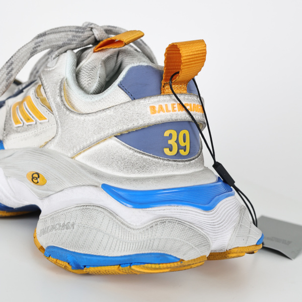 Balenciaga Cargo sneakers in a worn-out white, grey, orange, and blue