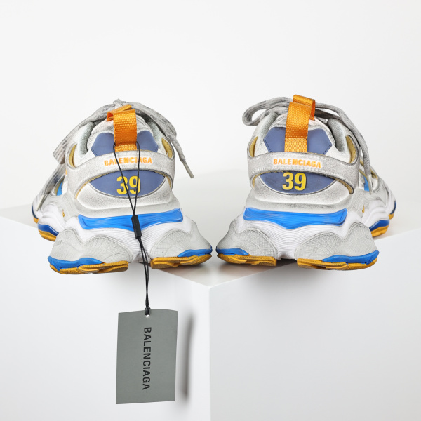 Balenciaga Cargo sneakers in a worn-out white, grey, orange, and blue