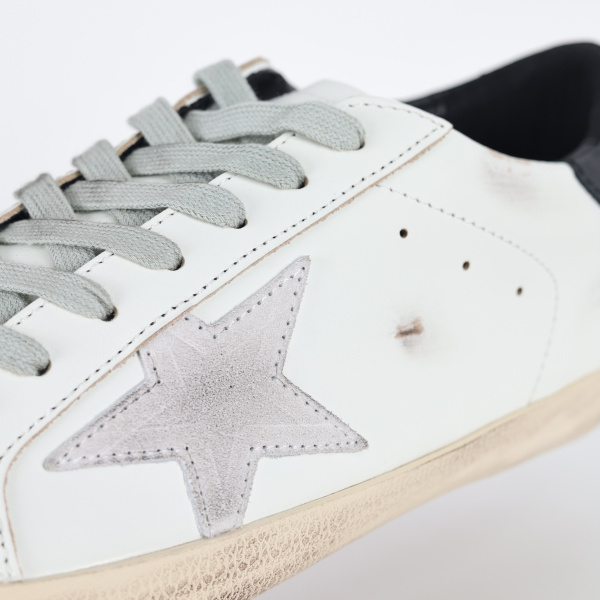 Golden G00se Super-Star trainers with black heels tab and metal stud lettering