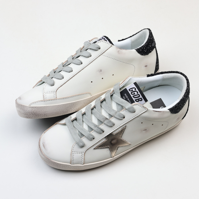 Golden G00se Super-Star trainers with gold star and black glitter heels tab