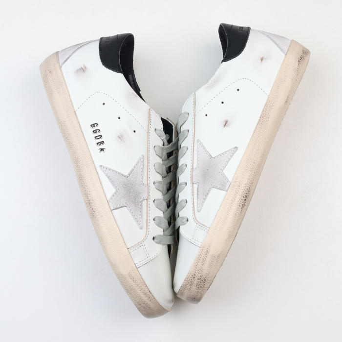 Golden G00se Super-Star trainers with black heels tab and metal stud lettering