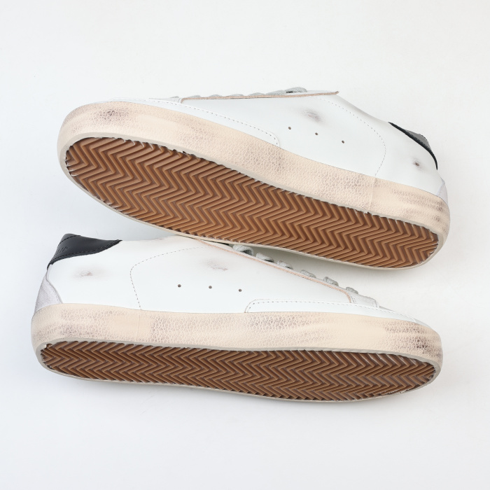 Golden G00se Super-Star trainers with black heels tab and metal stud lettering