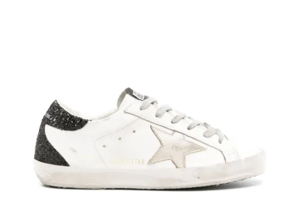 Golden G00se Super-Star trainers with gold star and black glitter heels tab